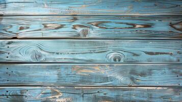 Old weathered wooden planks forming a rustic background with a blue vintage paint photo