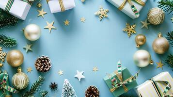 Christmas decorations forming a frame on a blue background with copy space in the center photo