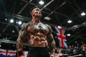 Tattooed bodybuilder showcases his muscles on stage at a bodybuilding competition photo