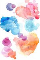 Colorful watercolor paints blend beautifully on a white background, creating abstract shapes in vibrant hues of blue, pink, orange, yellow, and red photo