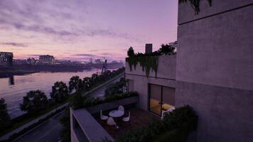 Balcony With Table and Chairs Overlooking a Body of Water video