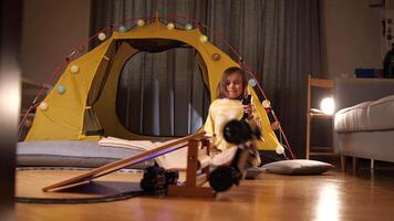 a child plays with a radio-controlled car, controls the car with remote control video