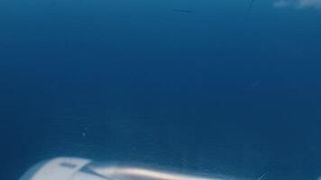 Aerial View from Airplane Wing Over Ocean video