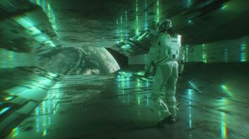 Astronaut Walking in Futuristic Tunnel with Neon Glowing Lights and Planet Earth View video