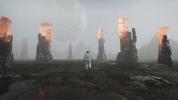 Astronaut Walks on the Surface of a Planet with a view of Space Landscape video