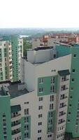 Panoramic view of modern residential complex in the city. Modern design of a multy-storeyed buildings in a new construction area. Aerial view Vertical video