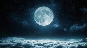 Full moon glowing over clouds with a starry night sky photo