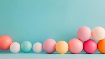 Colorful arrangement of spheres on a blue surface in a studio setting photo