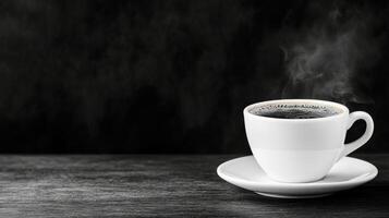 Freshly brewed black coffee in a white cup on a dark background photo