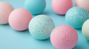 Colorful arrangement of spheres on a blue surface in a studio setting photo