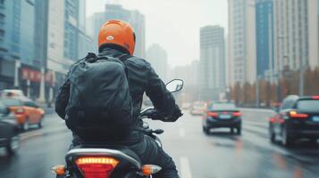 Biker riding through a bustling urban street in the evening photo