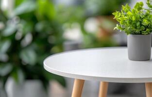 Small white table with a potted plant surrounded by lush green indoor foliage photo