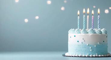 Colorful birthday cake with lit candles on a festive background photo