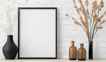 Minimalist interior decor with empty frame and dried flowers on a wooden table photo