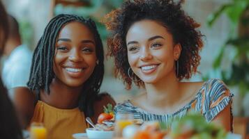 Friends enjoying brunch together at a cozy cafe with fresh food and drinks photo