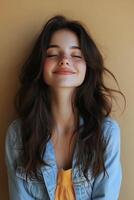 Young woman with a joyful smile wearing a casual outfit and necklace against a neutral backdrop photo