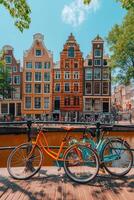 Colorful bicycles lined up along the canal in Amsterdam on a sunny day photo