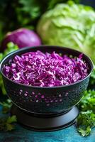 Chopped purple cabbage salad with fresh greens on a wooden cutting board photo