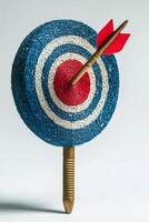 Arrow hitting blue and white target on weathered wooden surface photo