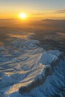 Stunning sunset over rugged mountains with dramatic cloud formations in the background photo