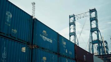Port containers huge harbor cargo load container dock ship transportation crane unloading shipment international distribution export import trade sea ocean transport in the bay naval video