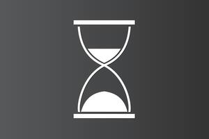 Classic sandglass icon on dark background to calculate time or hour vector