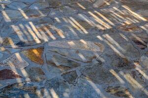 Abstract background from yellow texture on wall with sunlight. photo