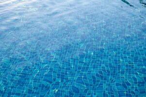 Swimming Pool Surface With Light Reflection and Water Ripple Patterns photo