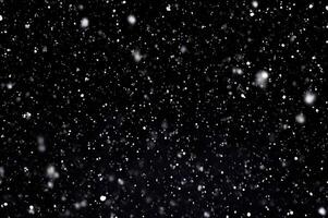 Detailed Snowfall Overlay Image Isolated on Black Background Perfect for Dynamic Visual Effects photo