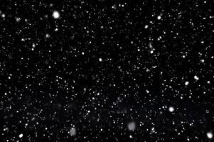 Detailed Snowfall Overlay Image Isolated on Black Background Perfect for Dynamic Visual Effects photo