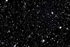 Detailed Snowfall Overlay Image Isolated on Black Background Perfect for Dynamic Visual Effects photo