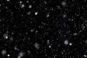 Detailed Snowfall Overlay Image Isolated on Black Background Perfect for Dynamic Visual Effects photo