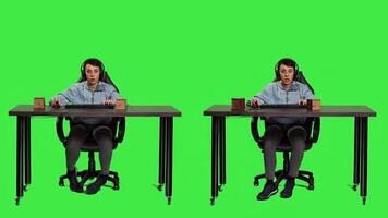 POV of gamer playing games online on computer and winning, celebrating victory after participating in gaming tournament on pc at desk. Player having fun with games against greenscreen. Camera A. photo