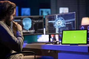 Isolated screen tablet next to sentient AI interacting with computer engineer, asking questions after modifying own source code. Chroma key device on desk next to self aware artificial intelligence photo