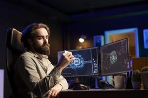 Hacker uploading evolved sentient AI to disk, planning to use it for evil mastermind plan. Rogue programmer putting malware infected artificial intelligence bot in cartridge photo