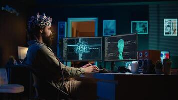 Developer with EEG headset on programming brain transfer into computer virtual world, becoming one with AI. Transhumanist using neuroscientific tech to transcend physical limitations, camera B photo