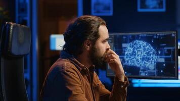 Programmer using computer to update artificial intelligence neural networks, drinking coffee and writing code scripts in home office. IT admin enjoying hot beverage while programming AI, camera A photo