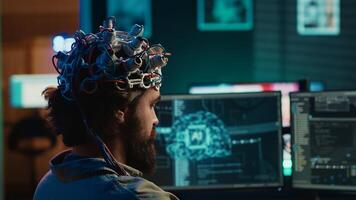 Developer using EEG headset device to upload his brain into computer, attaining immortality. Neuroscientist runs experiment, transfers consciousness into cyberspace, transhumanism concept, camera A photo