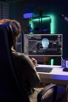 Programmer updating artificial intelligence neural networks, writing binary code scripts. Freelancing system administrator upgrading high tech AI in neon illuminated home photo