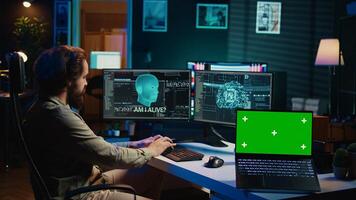 AI becoming sentient, chatting with computer scientist, asking existential questions, green screen laptop. Concept of artificial intelligence gaining consciousness, chroma key notebook, camera B photo