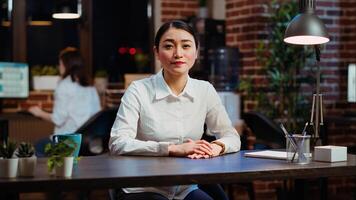 POV of asian human resources employee conducting interview with candidate during videocall in office. Portrait of HR worker using online videoconference app to speak with prospect photo