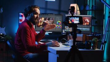 Videography content creator recording tutorial using professional camera, talking with audience about elevating quality with skillful editing techniques. Media production influencer films guide photo