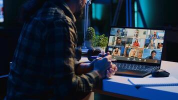 Employee working from home talking with coworkers during business meeting on videocall in office. Teleworker speaking in remote teleconference call from living room, camera A photo