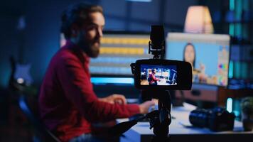 Focus on professional camera used by photographer in blurry background to record basic photography editing techniques guide for beginners. Recording equipment used by freelancer for tutorial, close up photo