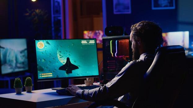 Man playing spaceship flying singleplayer game with overlay HUD showing health, fuel, ammo bars and minimap. Gamer navigating with spacecraft in galaxy, shooting at asteroids photo