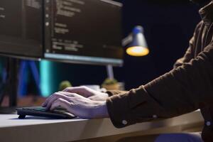 Computer scientist typing on keyboard, implementing security measures to protect company systems and data. IT specialist writing, testing and debugging Java code for software applications, close up photo