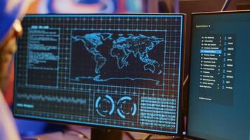 Meticulous hacker typing on computer keyboard, doing data breaches and financial theft in dark bunker. Close up shot on cybercriminal stealing users bank account credentials photo