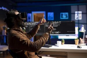 Man doing software quality assurance, reading source code using high tech VR headset. Developer inspecting coding using virtual reality technology, looking to fix potential issues photo