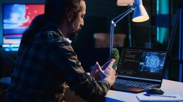 Data scientist updating artificial intelligence neural networks, writing complex binary code scripts. Teleworking freelancer in apartment office uses digital device programming to upgrade AI, camera A photo