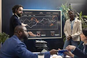 Executive team analyzing trends to help make essential decisions to corelate with corporation objectives. Business partners working together to meet project deadline, boardroom space. photo